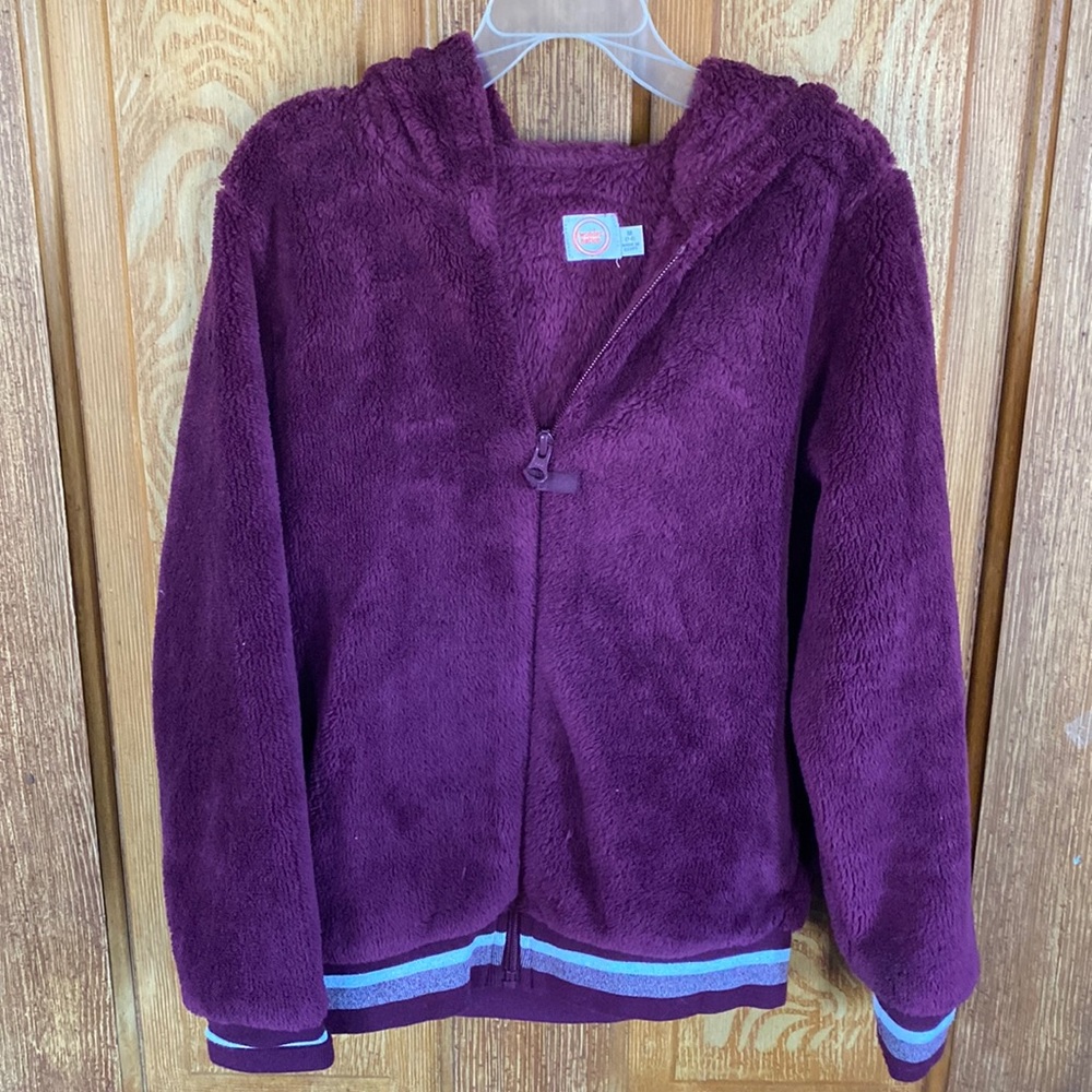 Nwot girls jacket size 7/8. Purple with silver stripe trim. Fuzzy!